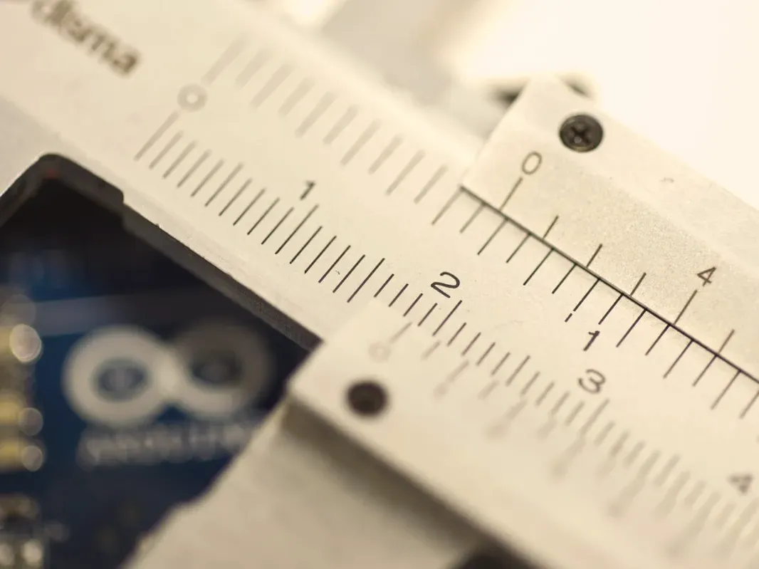 Caliper measuring a part